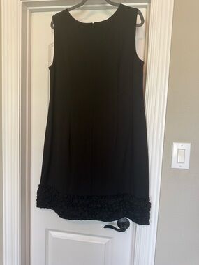 Classic Black Sleeveless Shift Dress with Ruffle Hem
